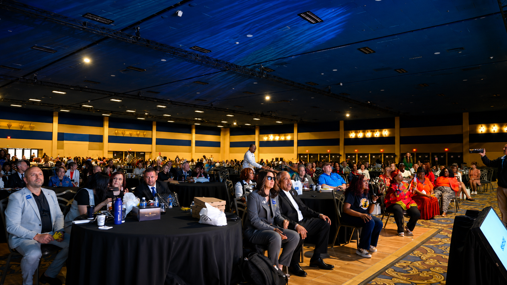 Large audience seated at a live Vacation Commissions conference event